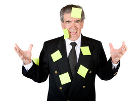 Man in a Business Suit With Post-it Notes All Over Him.jpg