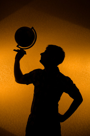 back_light_silhouette_of_man_holding_globe.jpg